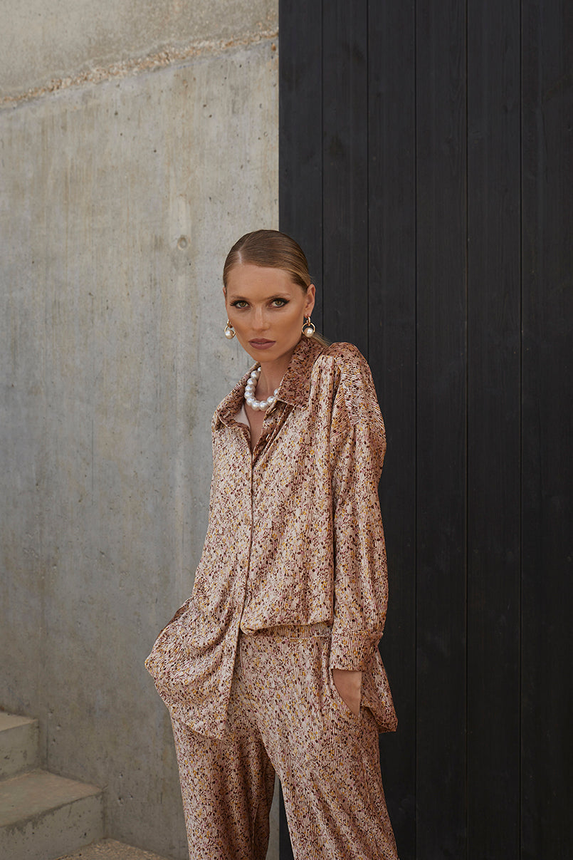 Calças de veludo estampado