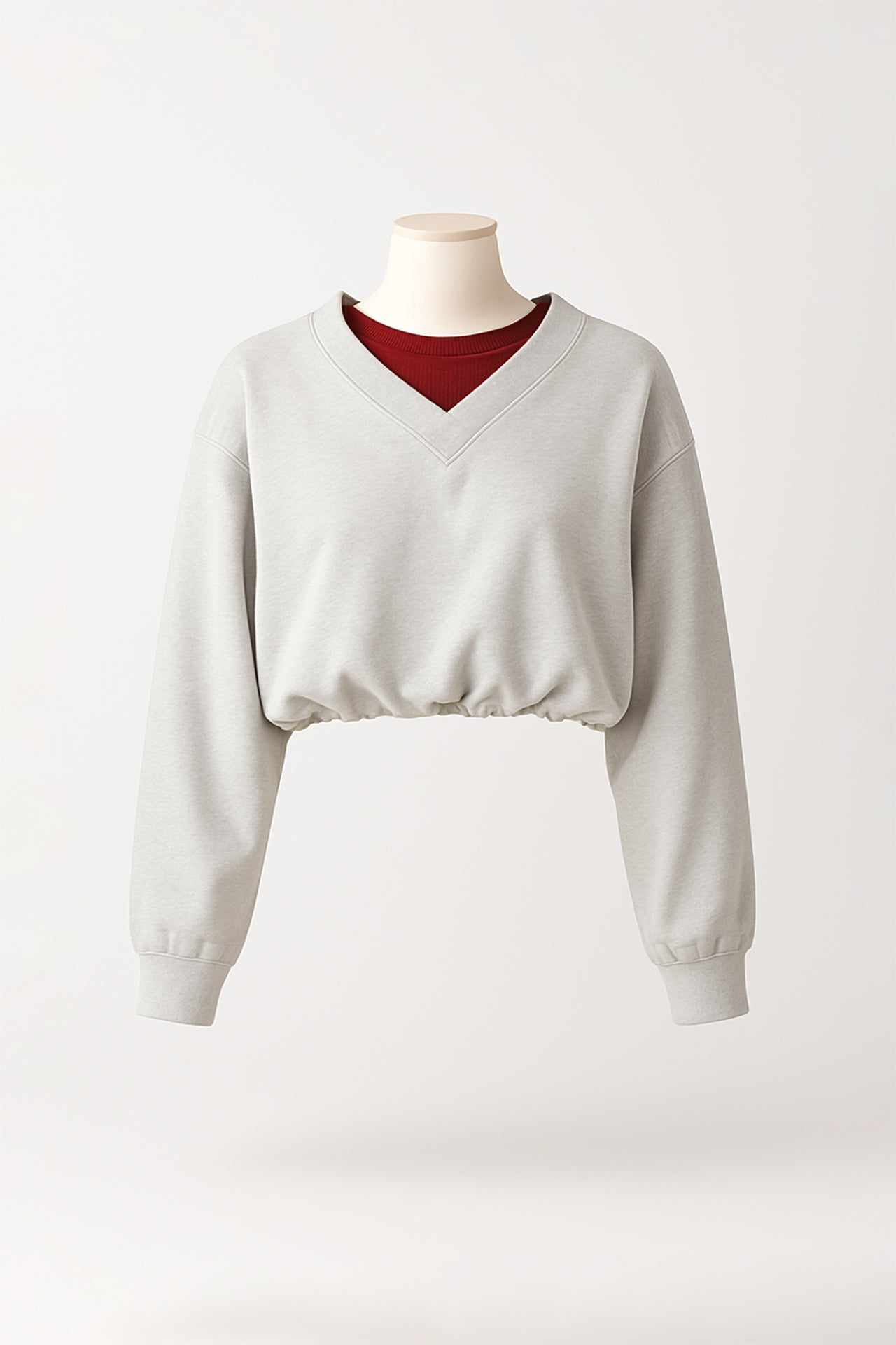 Sweatshirt cropped em cinzento com decote em V